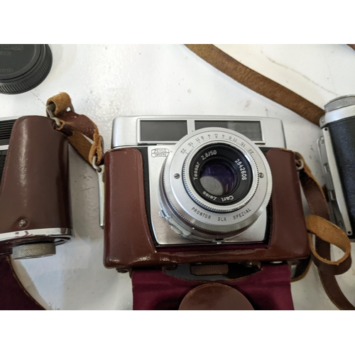 292 - Three vintage cameras to include and Olympus Trip 35, a Zeiss Ikon, an Ensign Selfix 820 along with ... 