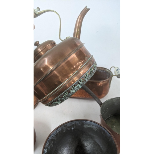 37 - A mixed lot of copperware to include a large twin handled cooking pot, a twin handled planter, a mea... 