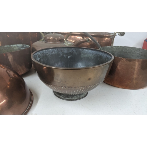 37 - A mixed lot of copperware to include a large twin handled cooking pot, a twin handled planter, a mea... 