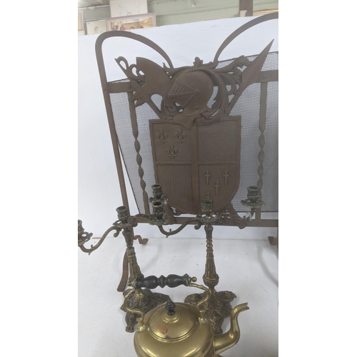 40 - A mixed lot of metalware to include fireside items to include fireside boy, two fire screens, and ot... 