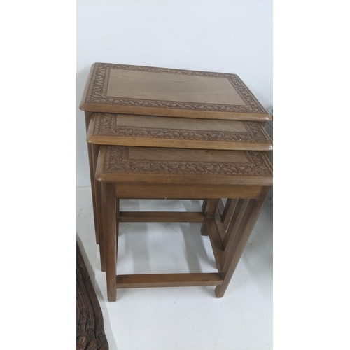 51 - A graduated set of Indonesian trays and a nesting set of three tables 
Location: LAM
If there is no ... 