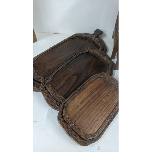 51 - A graduated set of Indonesian trays and a nesting set of three tables 
Location: LAM
If there is no ... 