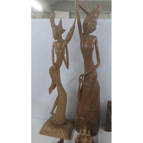 52 - Indonesian treen to include two carved figures, two book troughs and other items
Location:
If there ... 