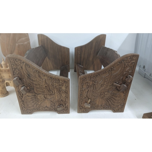 52 - Indonesian treen to include two carved figures, two book troughs and other items
Location:
If there ... 