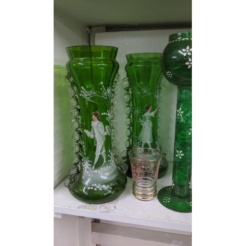 60 - An 19th century and later glassware to include: a pair of Victorian Mary Gregory large green vases, ... 