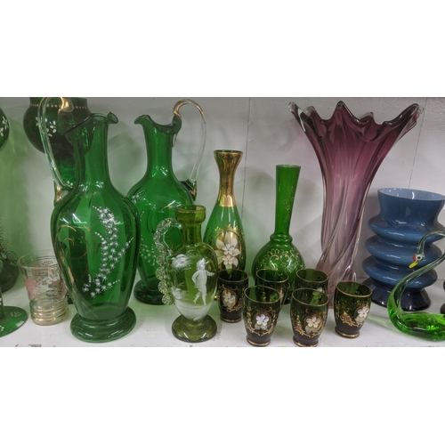 60 - An 19th century and later glassware to include: a pair of Victorian Mary Gregory large green vases, ... 