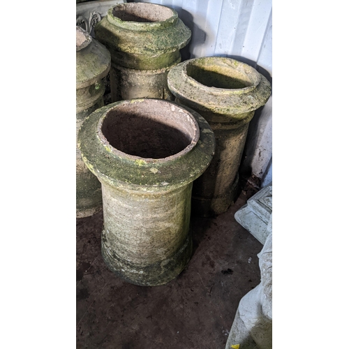 72 - Two pairs of Victorian terracotta chimney pots, the largest pair 64cm h, the smaller 55cm h
Location... 