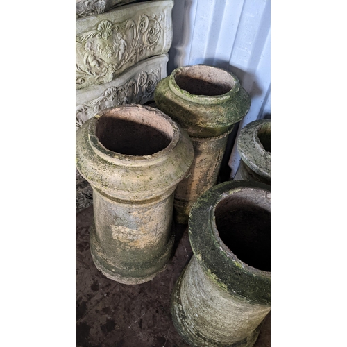 72 - Two pairs of Victorian terracotta chimney pots, the largest pair 64cm h, the smaller 55cm h
Location... 