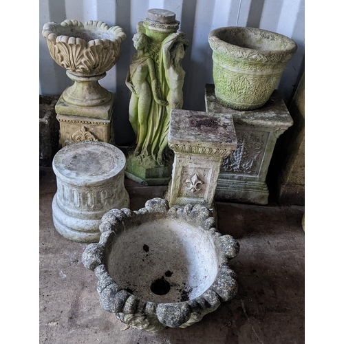 74 - A selection of garden stoneware planters and stands to include a stand in the form of three classica... 