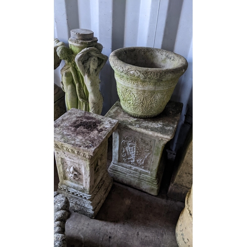 74 - A selection of garden stoneware planters and stands to include a stand in the form of three classica... 