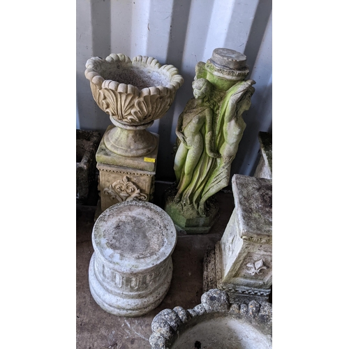 74 - A selection of garden stoneware planters and stands to include a stand in the form of three classica... 