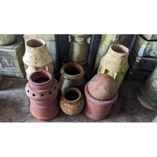 78 - A selection of garden related ornaments to include Victorian chimneys, terracotta planters and other... 