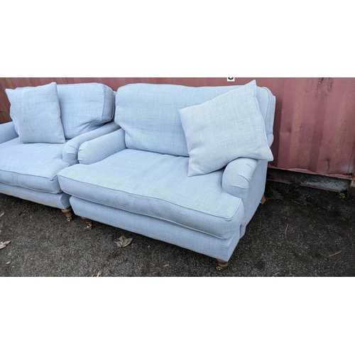 87 - A pair of modern blue upholstered two seater sofas, 80cm h x 129cm w
Location:
If there is no condit... 