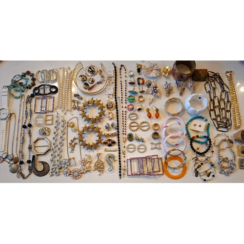 102 - A quantity of vintage costume jewellery and buckles to include a bone edelweiss bracelet with floral... 