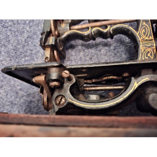 36 - A 19th Century, possibly Charles Raymond chainstitch sewing machine A/F, painted black and decorated... 