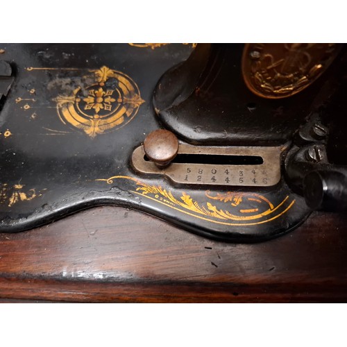 108 - An 1880's/90's Singer 12k 'New Family' sewing machine in a mahogany case, serial number 5804346 1244... 