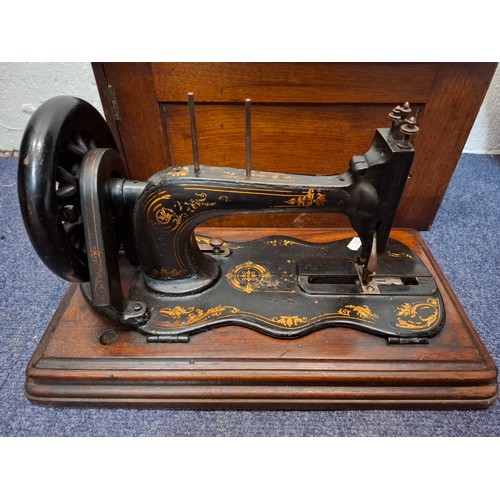 108 - An 1880's/90's Singer 12k 'New Family' sewing machine in a mahogany case, serial number 5804346 1244... 