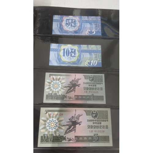 122 - Banknotes - An album of mixed Japanese and North Korean banknotes to include 1947 North Korean 5 won... 