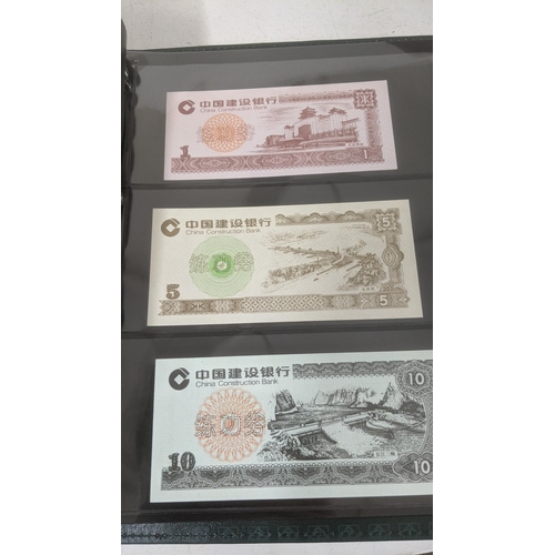 124 - Bank notes - Two albums comprising of Chinese Banknotes - Yuan Hong 80 cents note, Chinese central r... 