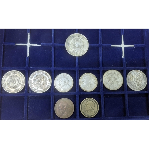 125 - A collection of white metal replica Chinese coins to include 'Fat Man' dollars Kwang -si Province on... 