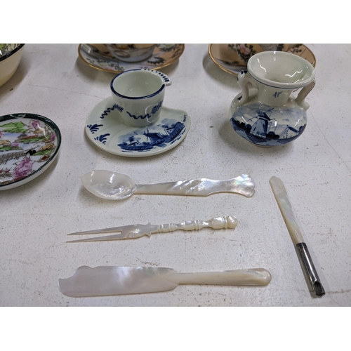 10 - A Japanese eggshell bachelor's tea set with other Oriental items, a small mother of pearl spoon, fis... 