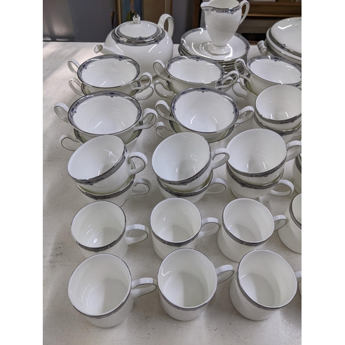 11 - A part Wedgwood tea service Amherst pattern to include a lidded treen, a teapot, milk jug, nine sauc... 