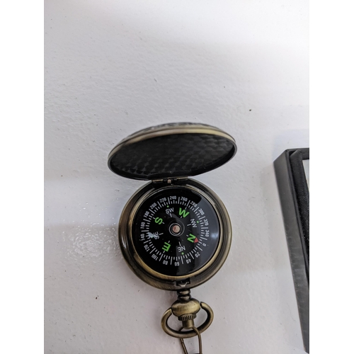 135 - A boxed reproduction Sekonda silver coloured pocket watch and boxed compass designed as a pocket wat... 