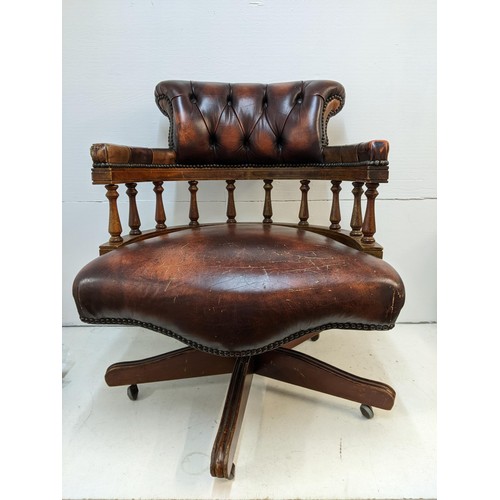 365 - A late 20th century brown leather upholstered and mahogany rotating, height adjustable desk chair Lo... 