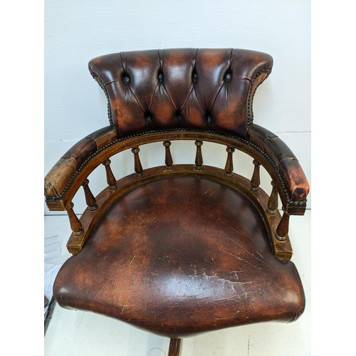 365 - A late 20th century brown leather upholstered and mahogany rotating, height adjustable desk chair Lo... 