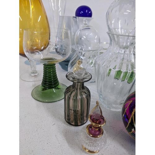 33 - A collection of art glass to include drinking glasses, vs, perfume bottles and other items
Location:... 