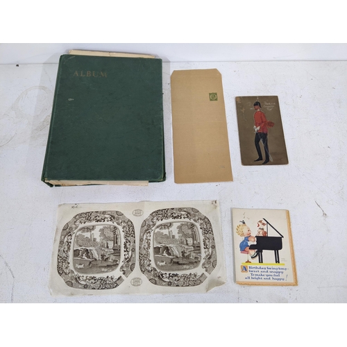 336 - A stamp album containing cigarette cards, pencil sketches and card cut-outs, a Mabel Lucie Attwell c... 