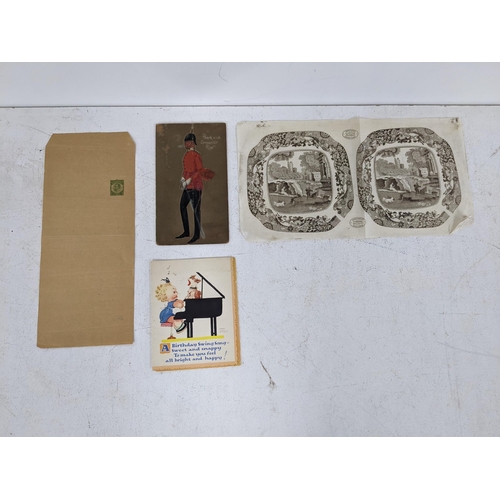 336 - A stamp album containing cigarette cards, pencil sketches and card cut-outs, a Mabel Lucie Attwell c... 