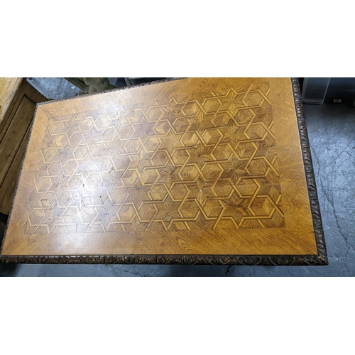 366 - A late Victorian oak parquetry inlaid top side table having a carved border with reeded legs, united... 