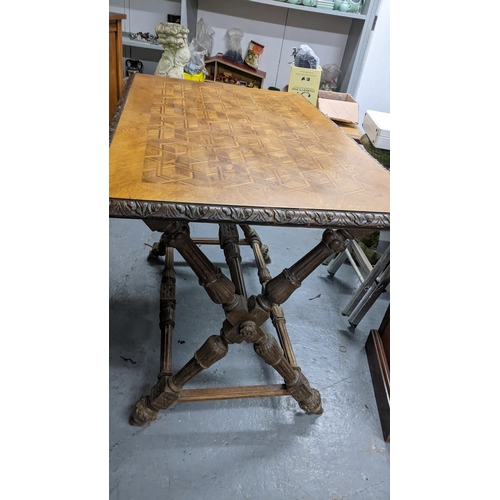 366 - A late Victorian oak parquetry inlaid top side table having a carved border with reeded legs, united... 