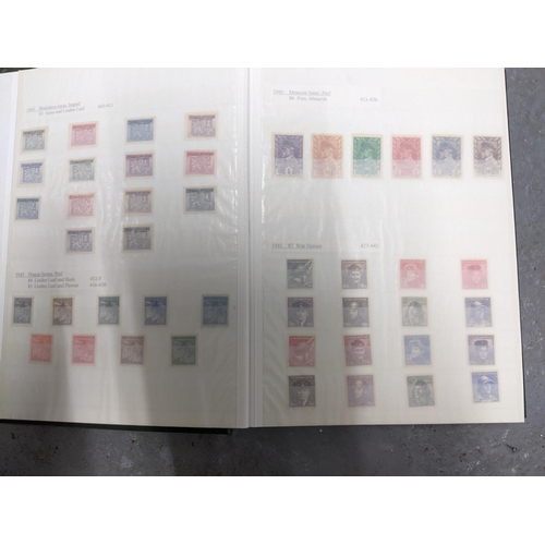 367 - A stamp collection of Czechoslovakian stamps mounted in four albums, along with a 1997 catalogue of ... 