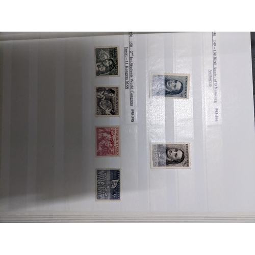 367 - A stamp collection of Czechoslovakian stamps mounted in four albums, along with a 1997 catalogue of ... 