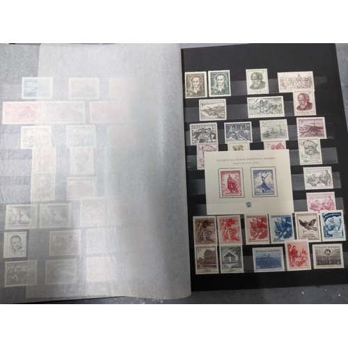 367 - A stamp collection of Czechoslovakian stamps mounted in four albums, along with a 1997 catalogue of ... 