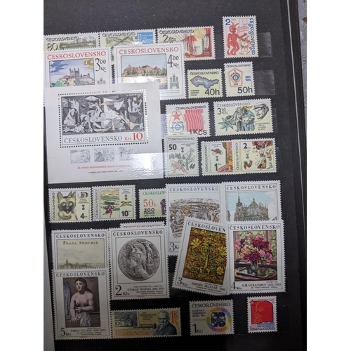 367 - A stamp collection of Czechoslovakian stamps mounted in four albums, along with a 1997 catalogue of ... 