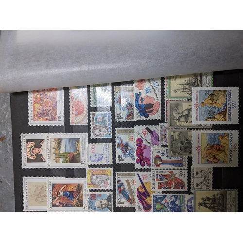 367 - A stamp collection of Czechoslovakian stamps mounted in four albums, along with a 1997 catalogue of ... 