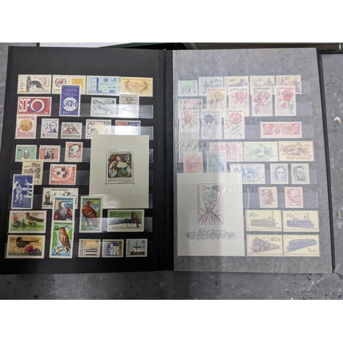 367 - A stamp collection of Czechoslovakian stamps mounted in four albums, along with a 1997 catalogue of ... 