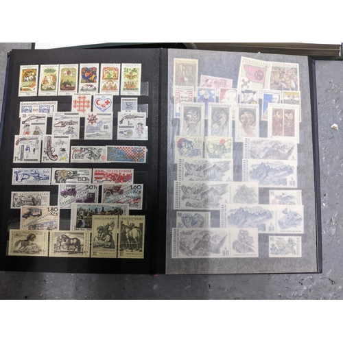 367 - A stamp collection of Czechoslovakian stamps mounted in four albums, along with a 1997 catalogue of ... 