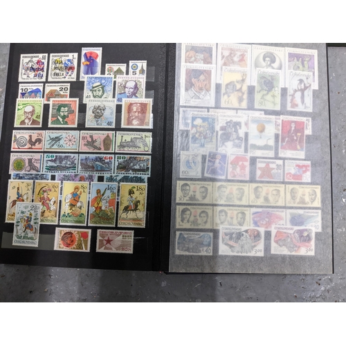 367 - A stamp collection of Czechoslovakian stamps mounted in four albums, along with a 1997 catalogue of ... 