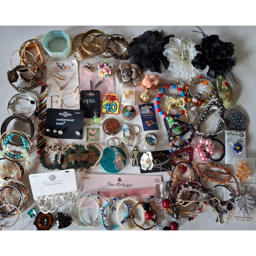 112 - A large quantity of modern costume jewellery, key rings, hair accessories, fashion and sports watche... 