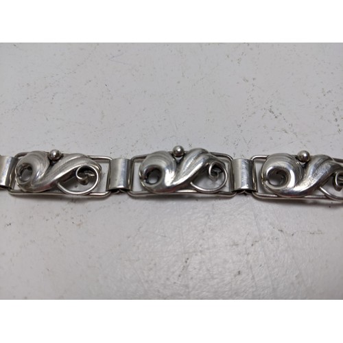 10 - A John Lauritzen Danish silver bracelet, with scrolled floral links, 19.5cm long
Location: CAB4
If t... 