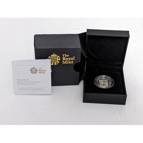 11 - A The Royal Mint £1 silver proof coin with a shield to the obverse, boxed with paperwork
Location:CA... 