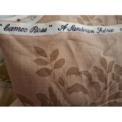 95 - A quantity of vintage fabric remnants to include a narrow width Sanderson 'Cameo Rose' cotton fabric... 