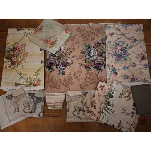 95 - A quantity of vintage fabric remnants to include a narrow width Sanderson 'Cameo Rose' cotton fabric... 