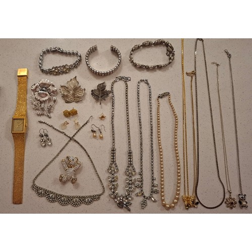 33 - A quantity of costume jewellery to include a Masj silver tone Poppy brooch, a Hollywood silver tone ... 