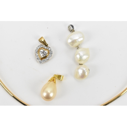 31 - A 9ct yellow gold rigid choker necklace with three interchangeable pendants, to include a drop pearl... 