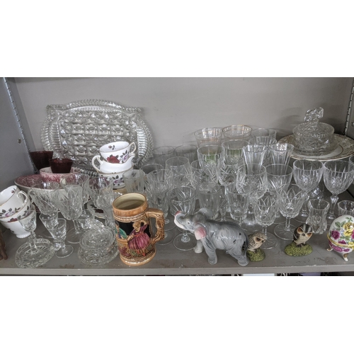 395 - A large mixed lot to include a quantity of crystal cut glass decanters, fruit bowl, drinking glasses... 